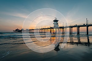 Sunset reflections and the pier in Huntington Beach, Orange County, California