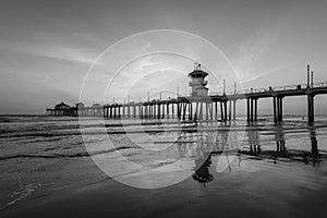 Sunset reflections and the pier in Huntington Beach, Orange County, California