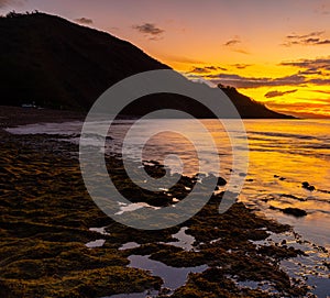 Sunset Reflections on The Tide Pools Along Oneuli Beach