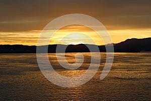 Sunset reflects off the water of the Inside Passage