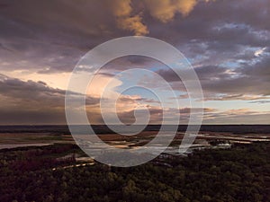 Sunset River Aerial Landscape Cinematic Drone Footage. Flying above Dniestr river in Ukraine or Moldova with forests and photo