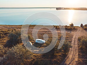 Sunset river and car with tent