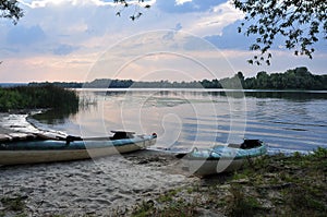 Sunset on the river, sports boats