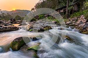 Sunset River Waterfall There are mosses on the rocks. During the summer, the water recedes