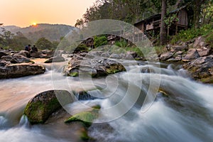 Sunset River Waterfall There are mosses on the rocks. During the summer, the water recedes