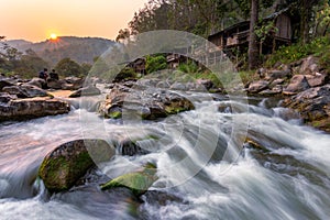 Sunset River Waterfall There are mosses on the rocks. During the summer, the water recedes