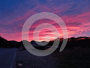 Sunset in the road: autimn red sky