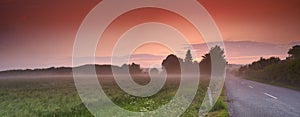 Sunset, road or nature with countryside travel, holiday or vacation with sky landscape in Denmark. Background, path or