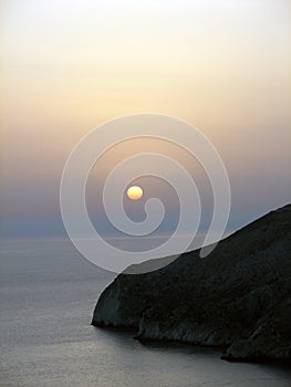 Sunset. Rock in Ionian sea