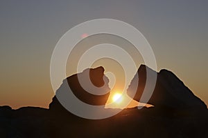 Sunset between rocks in the mountain. Very beautiful mountain scenery. Sunset View from the Top of a Mountain. between mountain