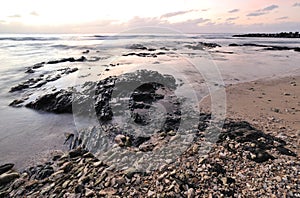 Sunset and rocky beach