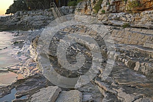 Sunset rocky beach in Istria, Croatia. HDR.