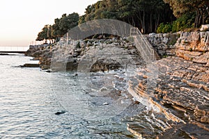 Sunset rocky beach in Istria, Croatia.