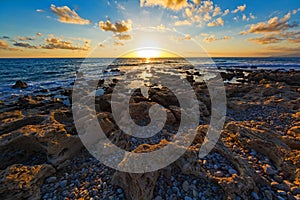 Sunset at a rocky coast in Peloponnese, Greece.