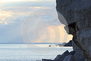 Sunset on rocky coastline