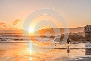 Sunset romp through the Surf at Walker Bay