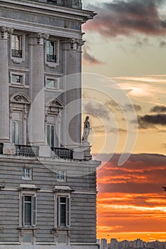 Sunset at Royal Palace Palacio Real Columns windows and corner sulpture. Madrid, Spain