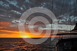 Sunset Sail Glows Orange over the Indian Ocean: Australia