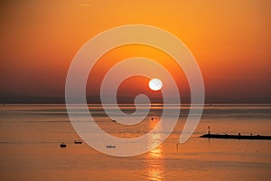 Sunset sail unfurls along the idyllic Omis Riviera, Adriatic Mediterranean Sea. Dramatic hues paint the sky as a romantic day