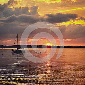 Sunset with Sailboat and Clouds on Geneva Lake in Wisconsin