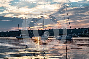 Sunset and sailboats in Boothbay Harbor, Maine