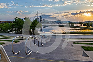 Sunset scene of flooded Tom Hanafan River`s edge park Council Bluffs Iowa