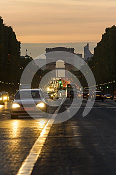 Sunset scene in Paris city. photo of street traffic near Arc de Triomphe, Champs Elysees boulevard