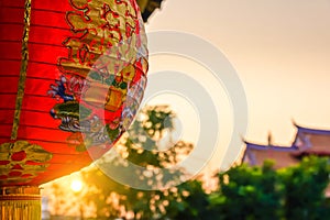 Sunset scene of red lanterns decorations hanging on chinese temple roof