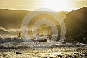 Sunset scene on rocky beach of South Wales coast,Uk.