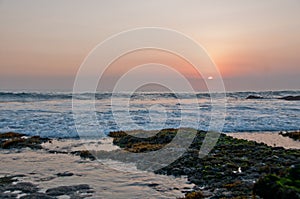 Sunset scene at Tanah Lot beach in Bali Indonesia evening