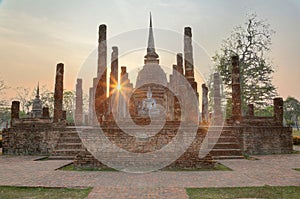 Sunset scenery of Wat Sa Si in Sukhothai Historical Park with setting sun