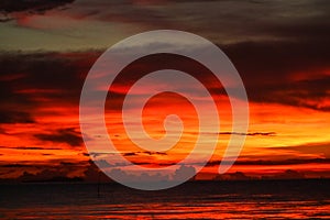 sunset on sea and ocean last light red sky silhouette cloud