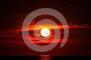 sunset on sea and ocean last light red sky silhouette cloud