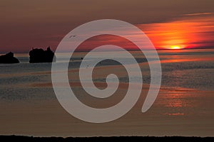 Sunset on the sea of Okhotsk. The sun goes below the horizon.