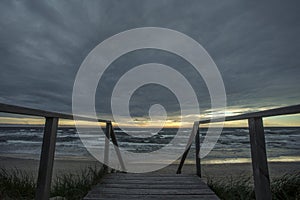 Sunset on the sea from sand beach on the Curonian spit