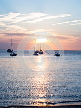 Sunset at the sea, ships in the distance