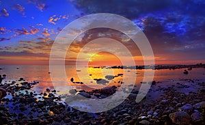 Sunset and sea stones