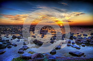 Sunset and sea stones