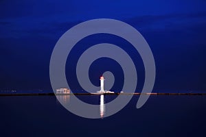 Sunset in the seaport of Odessa. Night views of piers and ships.