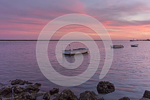 Sunset seascape view of Olhao dockyard, waterfront to Ria Formosa. Algarve