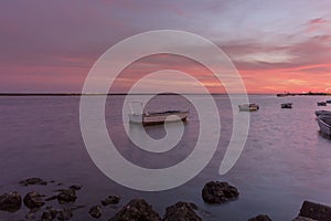 Sunset seascape view of Olhao dockyard, waterfront to Ria Formosa. Algarve