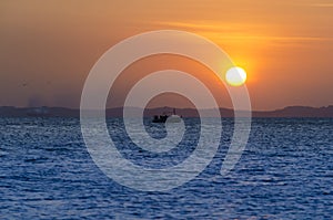 Sunset seen from Ribeira beach in Salvador, Bahia, Brazil.