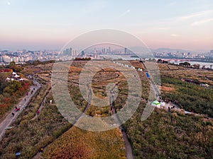 Sunset in Seoul. Aerial Cityscape. South Korea. Skyline of City. Mapo District. Haneul Park in Background. Han River photo