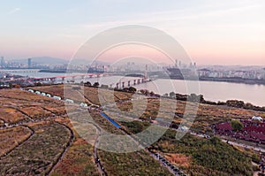 Sunset in Seoul. Aerial Cityscape. South Korea. Skyline of City. Mapo District. Haneul Park in Background. Han River photo