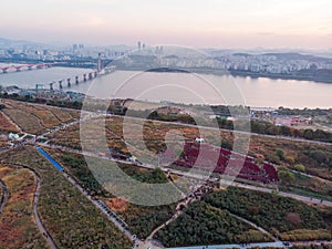 Sunset in Seoul. Aerial Cityscape. South Korea. Skyline of City. Mapo District. Haneul Park in Background. Han River photo