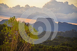 sunset in the serra da mantiqueira with the pedra do bau in the background photo