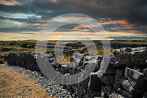 Sunset Settles over Miles of Stonewalls which Weave throughout the Irish Landscape