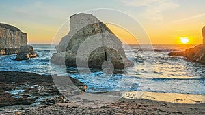 Sunset at Shark Fin Bay, beautiful beach landscape on the coast of the California Highway, ocean, rocks, aerial view.