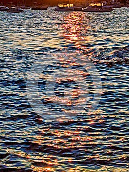 Sunset Shining on Rippled Sea Water