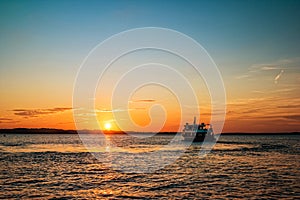 Sunset with ship sailing to the Brijuni Islands in Fazana, Croatia